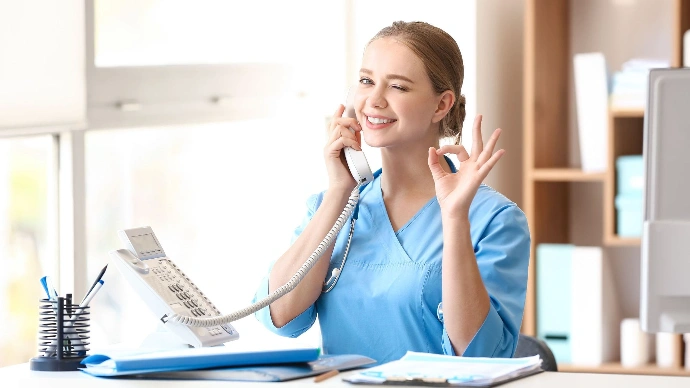 doctor-using-office-phone-smiling-and-happy