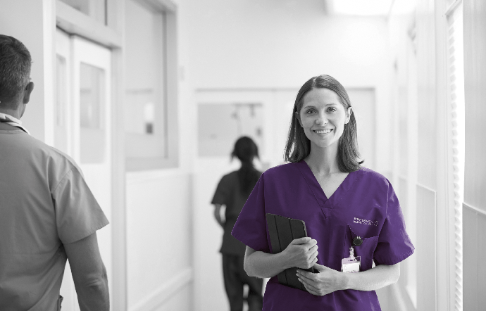 portrait-of-smiling-female-doctor-wearing-scrubs